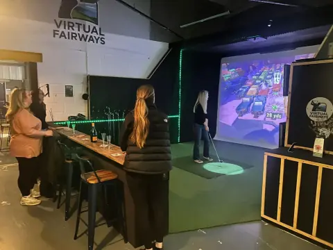 A group enjoying ladies' night at the Virtual Fairways simulator bays in Darlington